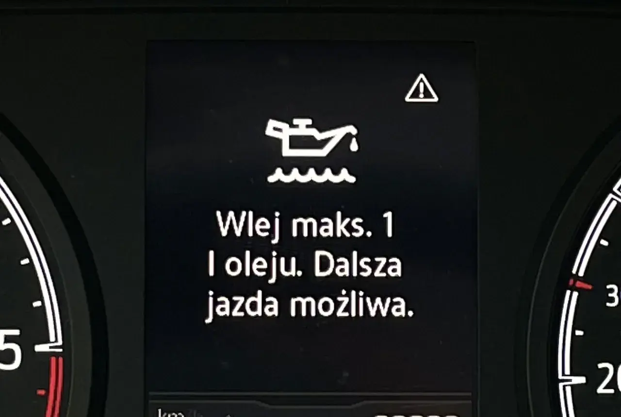 Kontrolka oleju z falą: "Wlej maks. 1 l oleju. Dalsza jazda możliwa." Ostrzeżenie o niskim poziomie oleju.